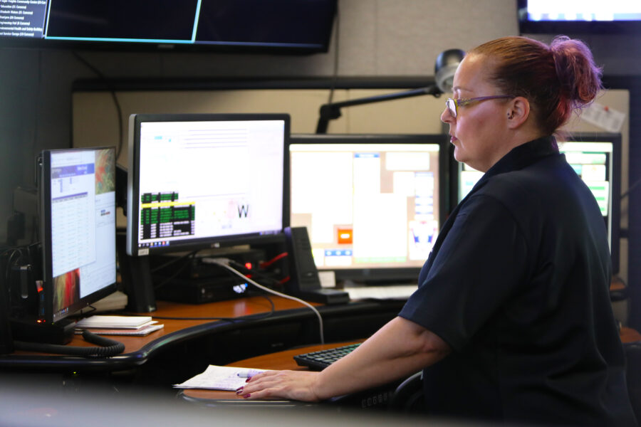 person sitting at a screen monitor